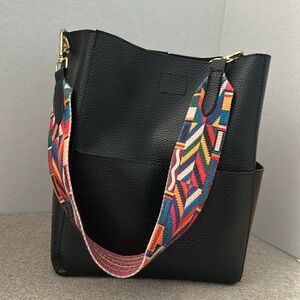 Black faux leather hobo bag. Outside pockets. Colorful strap. Pre-owned